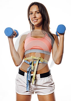 Young pretty slim woman with dumbbell isolated