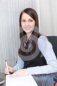 Young pretty smiling business woman