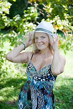 Young pretty spring woman in a green forest