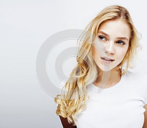 young pretty stylish blond girl posing emotional isolated on white background happy smiling cool smile