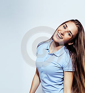 Young pretty stylish brunette hipster girl posing emotional isolated on white background happy smiling cool smile