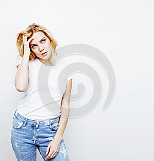 Young pretty stylish hipster blond girl posing emotional isolated on white background happy smiling cool smile