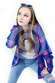 Young pretty stylish hipster girl posing emotional isolated on white background happy smiling cool smile, lifestyle