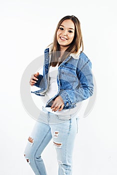 Young pretty stylish hipster girl posing emotional isolated on white background happy smiling cool smile, lifestyle