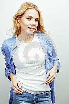 Young pretty stylish hipster teen girl posing emotional isolated on white background happy smiling cool smile, lifestyle