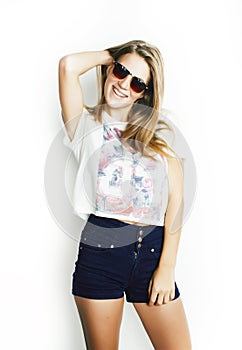 Young pretty teen blond girl posing cheerful isolated on white background wearing sunglasses, lifestyle people concept