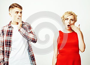 Young pretty teenage couple, hipster guy with his girlfriend happy smiling and hugging on white background