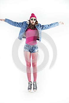 Young pretty teenage girl jumping cheerful isolated on white background, lifestyle people concept