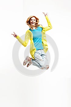 Young pretty teenage girl jumping cheerful isolated on white background, lifestyle people concept