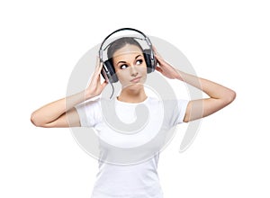 Young and pretty teenage girl listening to the music