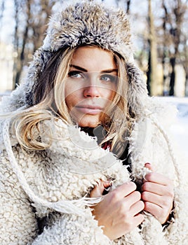 Young pretty teenage hipster girl outdoor in winter snow park ha