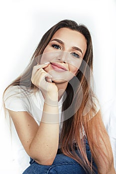 Young pretty teenage hipster girl posing emotional happy smiling on white background, lifestyle people concept