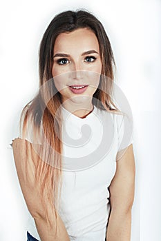 Young pretty teenage hipster girl posing emotional happy smiling on white background, lifestyle people concept