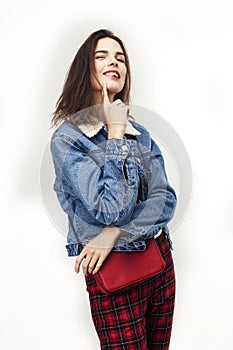 Young pretty teenage hipster girl posing emotional happy smiling on white background, lifestyle people concept