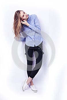 Young pretty teenage hipster girl posing emotional happy smiling on white background, lifestyle people concept