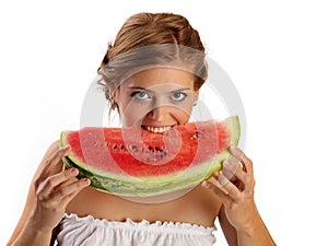 Young pretty woman biting slice of watermelon