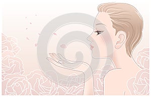 Young pretty woman blowing on petals of roses