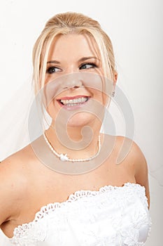 Young pretty woman bride in white veil