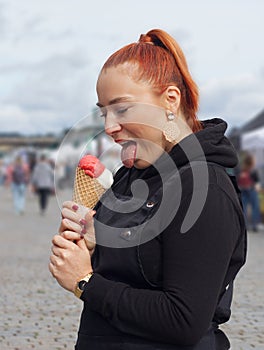 Young pretty woman with cone of ice cream