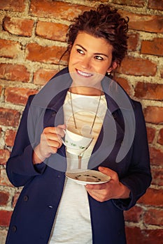 Young pretty woman drinking coffee