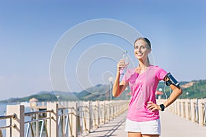 Young pretty woman drinking water