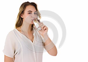 Young pretty woman drinks water Bottle or glass of spring water