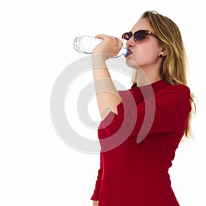 Young pretty woman drinks water Bottle or glass of spring water