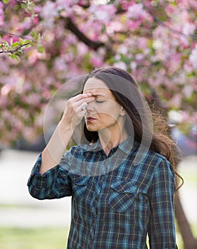 Woman having symptoms of spring pollen allergy