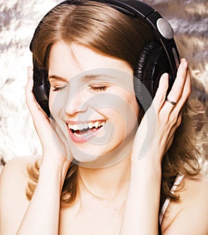 Young pretty woman in headphones listening music, singing a song happy smiling, lifestyle people concept