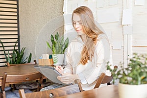 Young pretty woman with laptop gadget indoor