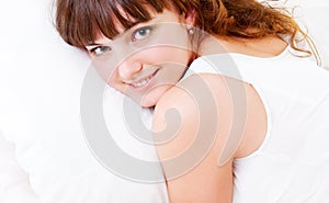 Young pretty woman lying on pillow