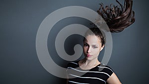 Young pretty woman portrait with ponytail studio shot