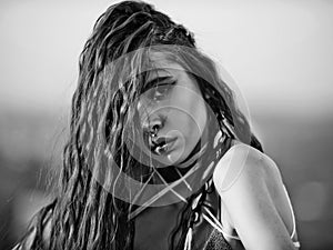 Young pretty woman with rope in dreadlocks in hair