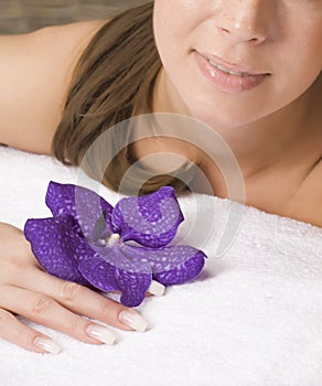 Young pretty woman in spa salon with manicure and