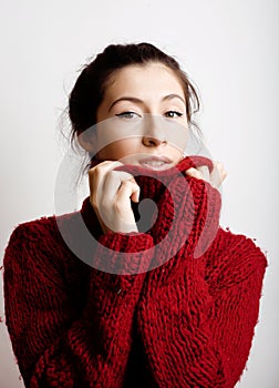 Young pretty woman in sweater and scarf all over her face, lifestyle people winter concept