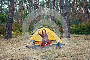 Young pretty woman tourist making selfie in camping Travel outdoors concept