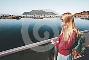 Young pretty woman walking at seaside alone