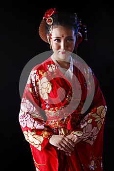 Young pretty woman wearing red kimono