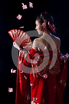 Young pretty woman wearing red kimono