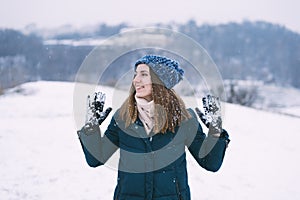 Young pretty woman in winter clothes smiling