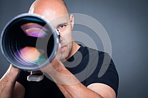 Young, pro male photographer in his studio