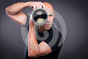 Young, pro male photographer in his studio