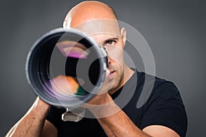 Young, pro male photographer in his studio