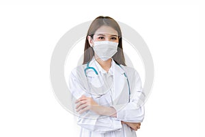 Young professional Asian woman doctor wears medical coat and face mask while arm crossed while working at hospital while isolated