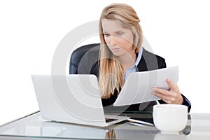 Young professional business woman working at desk