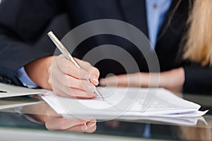 Young professional business woman working at desk