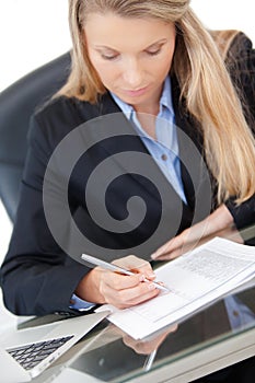 Young professional business woman working at desk