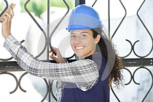 Young professional construction worker using sandpaper