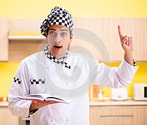 Young professional cook preparing in kitchen