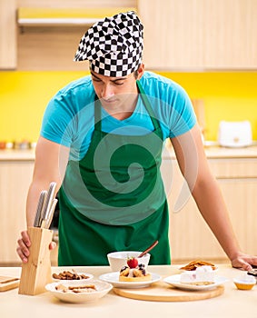 Young professional cook preparing in kitchen
